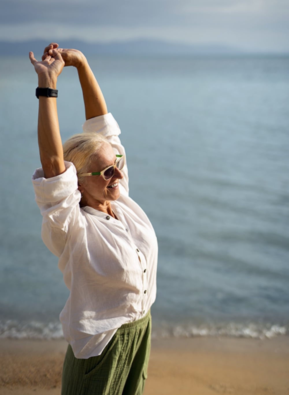 Woman stretching on the beach