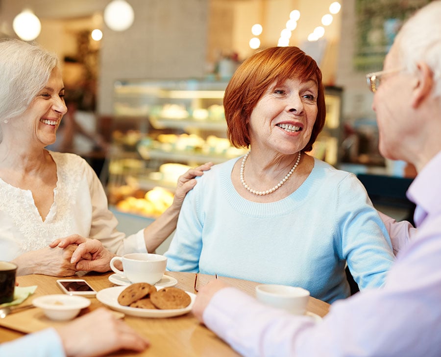 People at a table with dessert